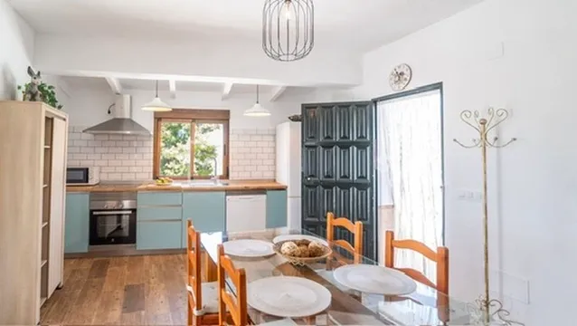 Dining table for four and the kitchen