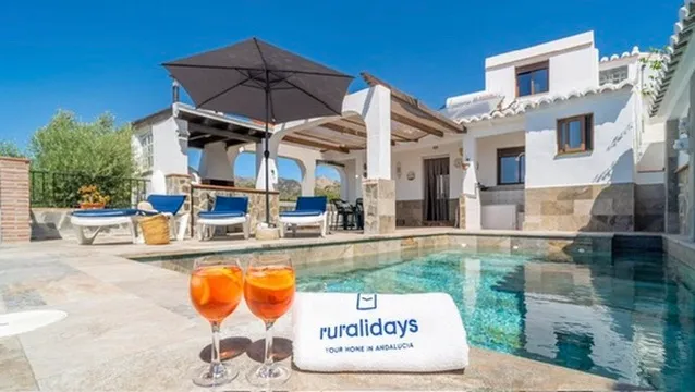 Private pool in front of the whitewashed house